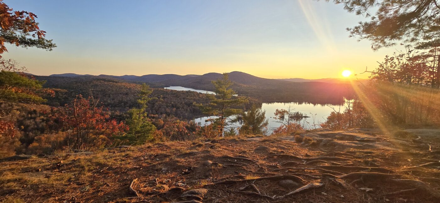 Aerial view of Bethel Maine surrounded by western Maine mountains.